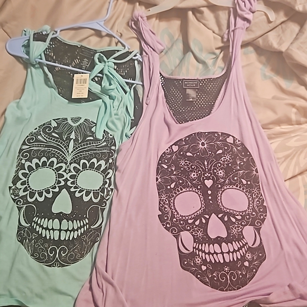 Set of 2 tank tops, teal & purple. Glitter skulls on front & see-through backs.